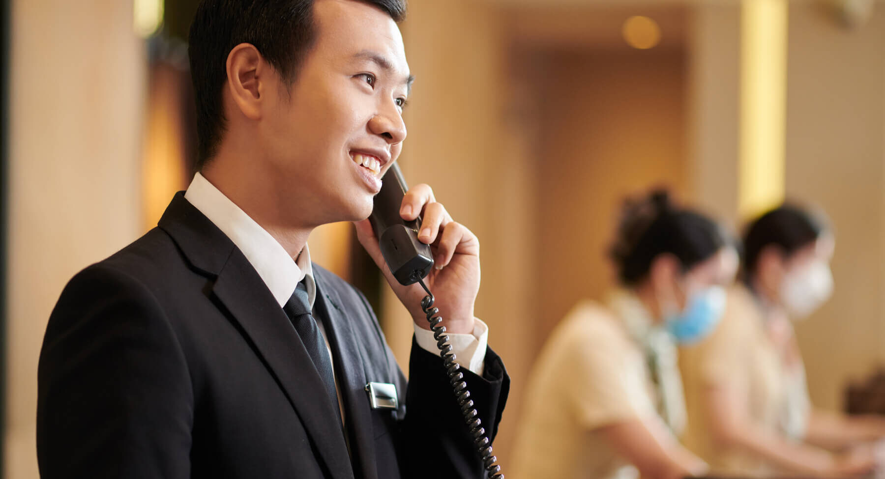 hotel-manager-answering-call-from-guest-2023-11-27-05-35-24-utc-1-1.jpg